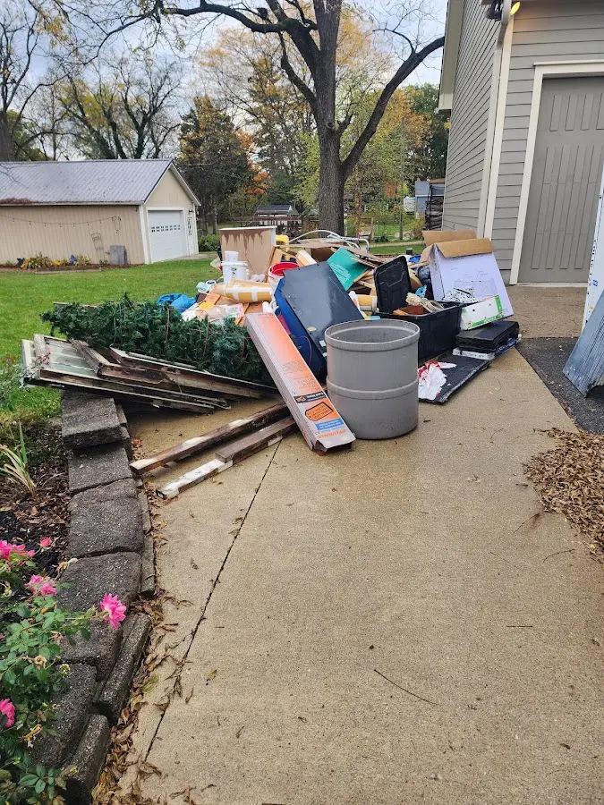 Dumpster being loaded with debris for Commercial Dumpster Rental in Ballville
